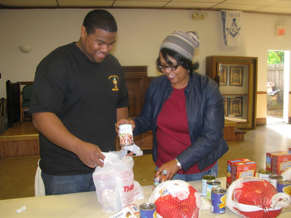 Tryone Loney packs Turkey Dinners